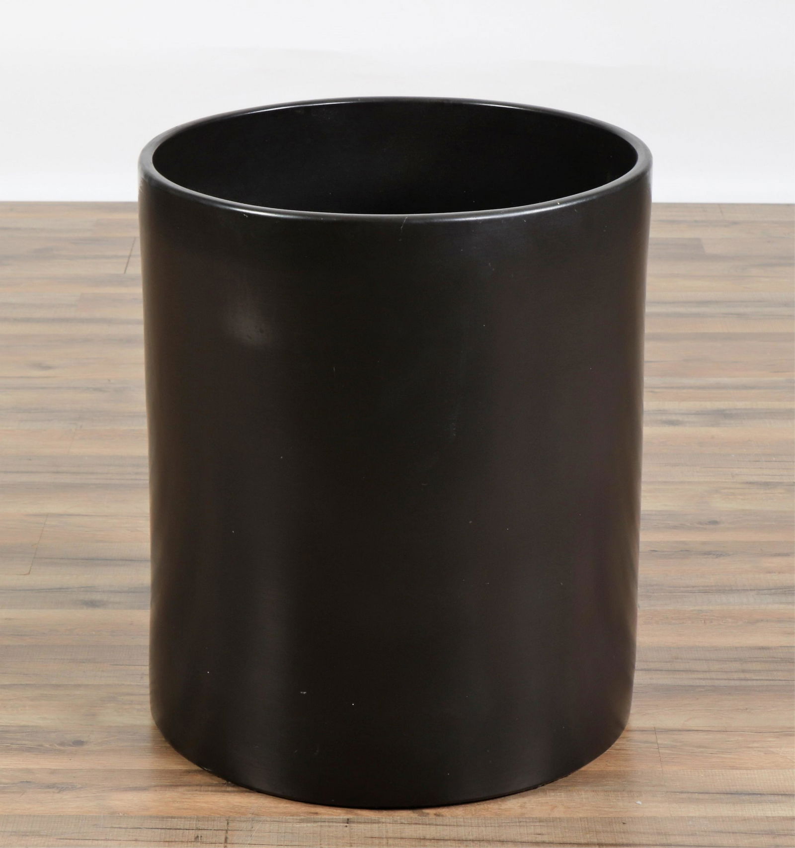 Architecture Pottery Black Glazed Jardiniere: Architecture Pottery Black Glazed Jardiniere, impressed mark interiorDimensions: 22" H x 18.5" Dia. Property from the Estate of John 'Parker' Prindle, Jr., Boston, MA.