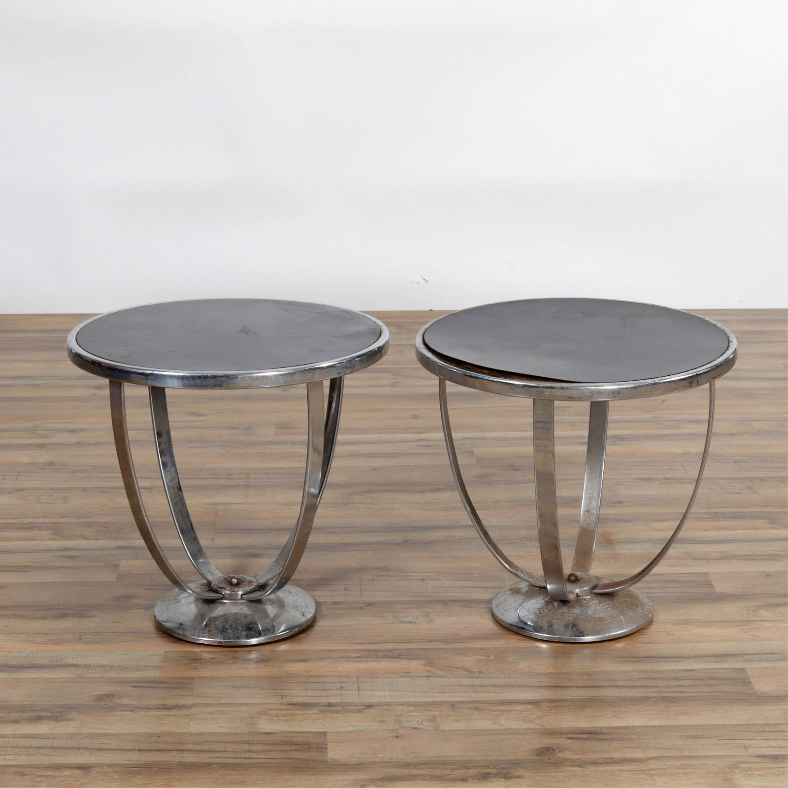 Pair of Wolfgang Hoffmann for Howell Side Tables: Pair of Wolfgang Hoffmann for The Howell Co. Chrome Side Tables, circa 1930. Dimensions: 19" H x 19.75" diam Property from the Estate of John 'Parker' Prindle, Jr., Boston, MA.