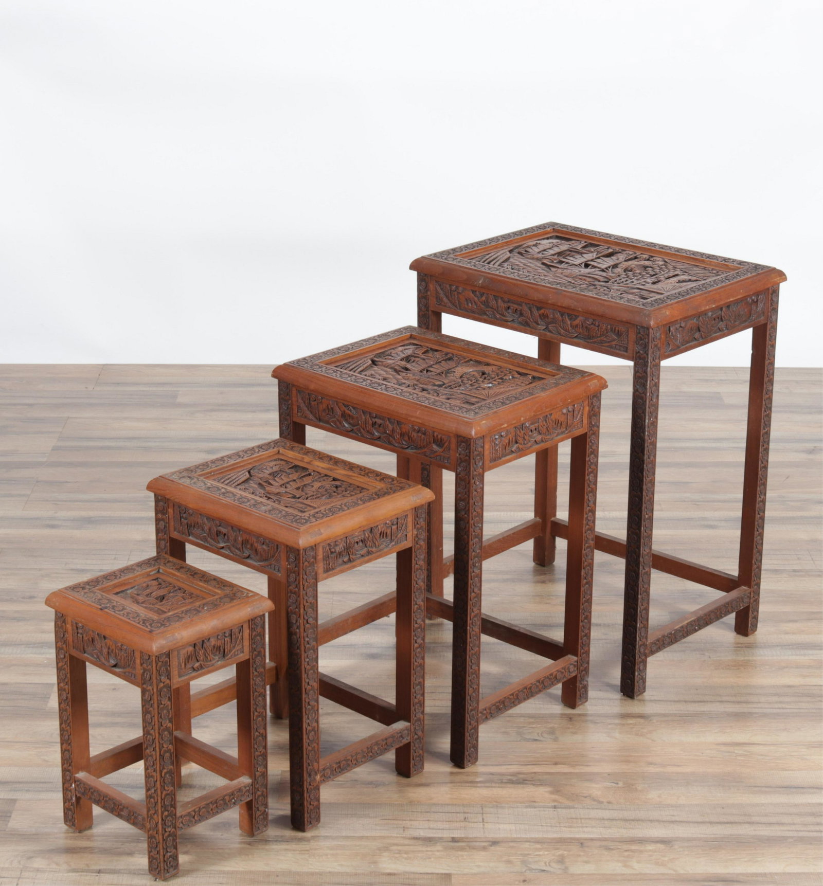 Nest of 4 Southeast Asian Teak Tables: Nest of 4 Southeast Asian Teak Tables Dimensions: 26.25" H x 20" W x 14.5" D Property from the Estate of John 'Parker' Prindle, Jr., Boston, MA.