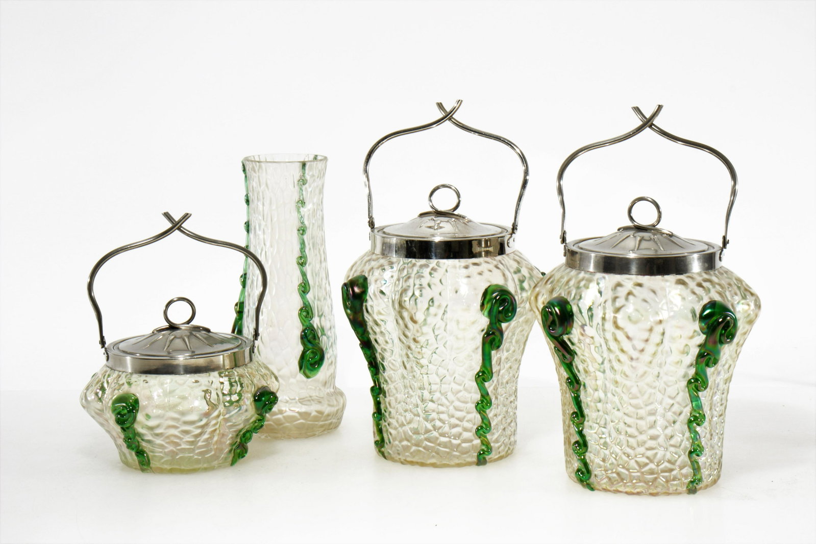 Loetz Iridescent Glass & Metal Biscuit Jars: Loetz Iridescent Glass & Metal Biscuit Jars, together with vase. Vase is signed on bottom, others unsigned. Dimensions: Vase 8.25" H, larger jars Property from the Estate of John 'Parker' Prindle, Jr.