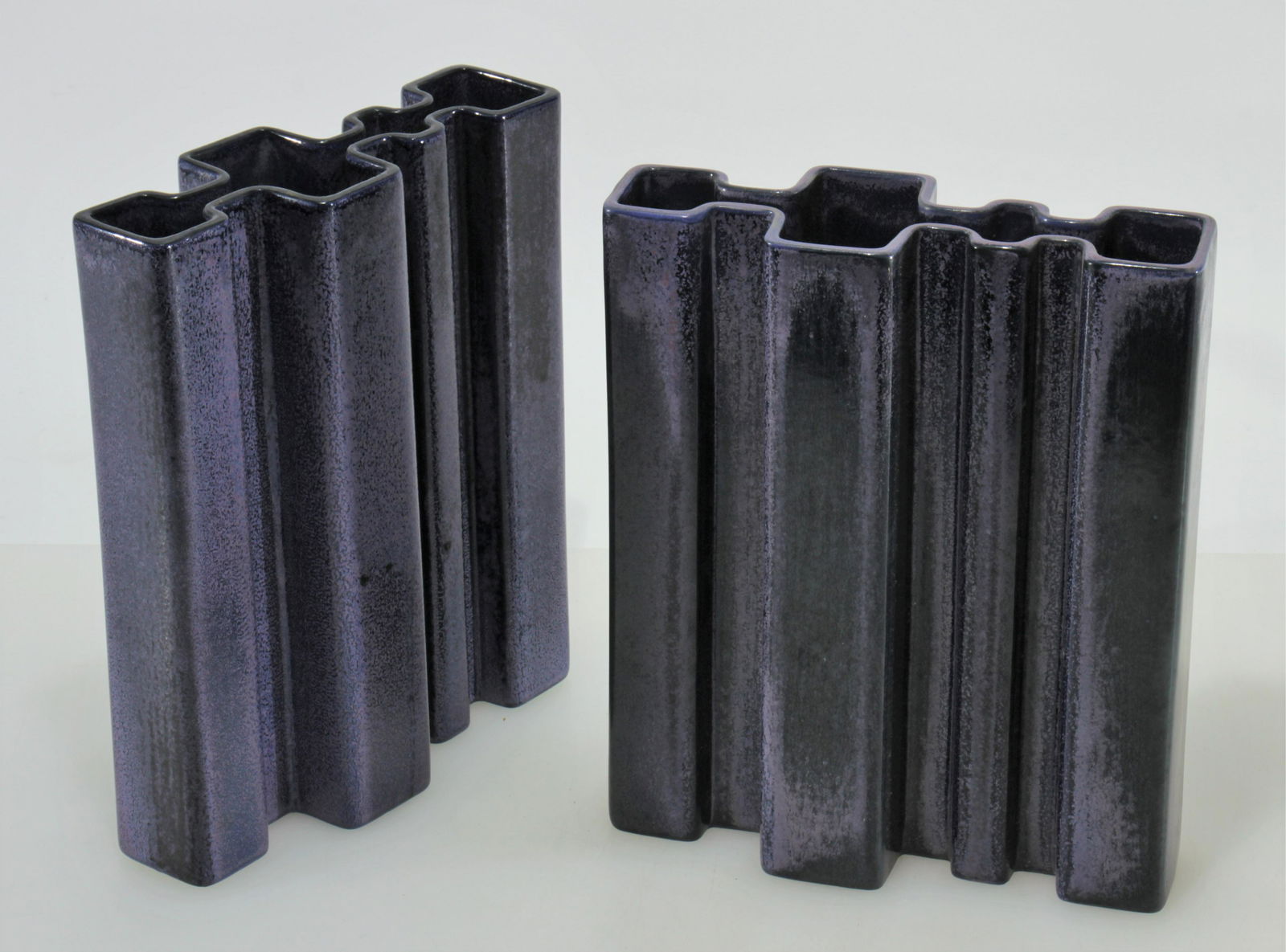 Angelo Mangiarotti - Pair of Vases: Angelo Mangiarotti for Fratelli Brambilla, Pair of blue violet ceramic vases. Stamped on bottom. Dimensions: 10.25 x 8.5 x 3.25" Property from the Estate of John 'Parker' Prindle, Jr., Boston, MA.