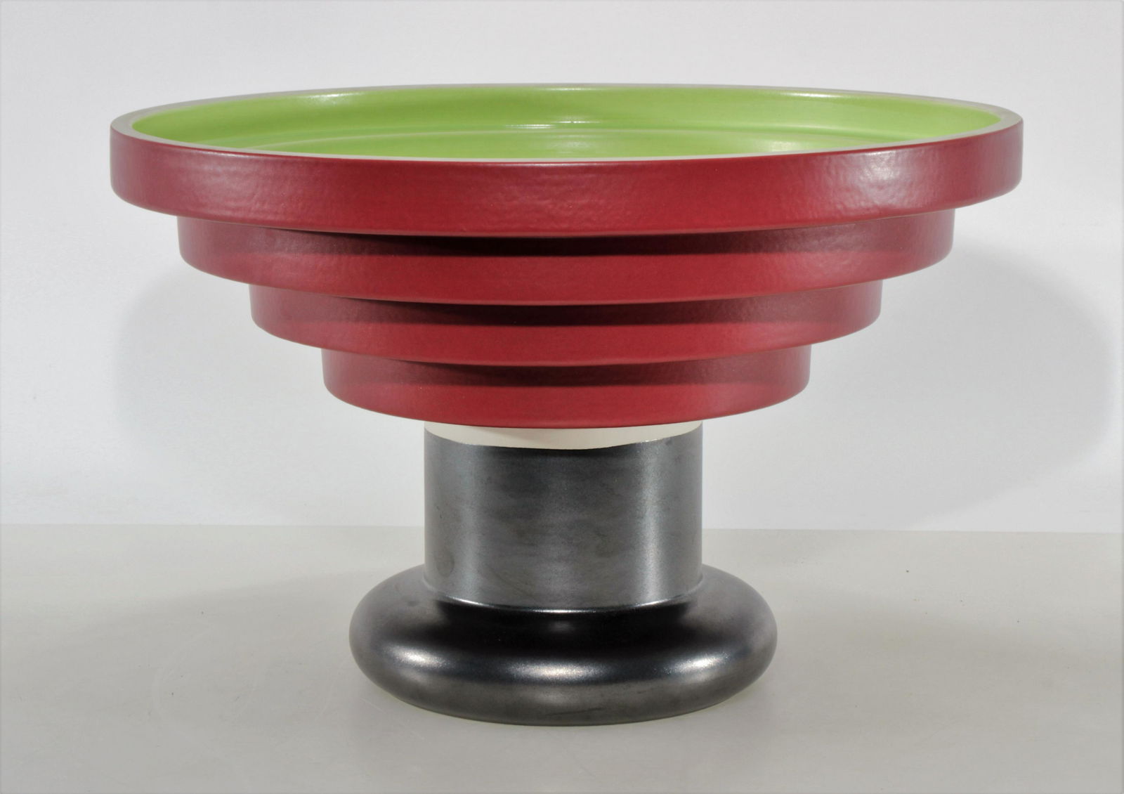 Ettore Sottsass - Large Centerpiece Bowl: Ettore Sottsass (1917 - 2007) for Bitossi, large ceramic centerpiece concentric stepped bowl on footed pedestal. Signed on bottom. Dimensions: 10" H x 15" diam Property from the Estate of John 'Parker