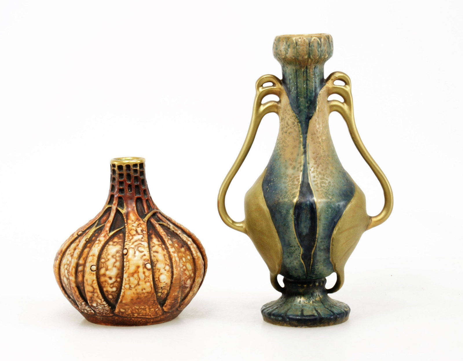 2 Amphora Porcelain Bud Vases, Early 20th C.: 2 Amphora Porcelain Bud Vases, Early 20th C., one marked 9486 Etruria, the other impressed Amphora 8949/4 Dimensions: larger 9" H; 5.5" Wsmaller 5.5" H; 5" W Property from the Estate of John 'Parker' 