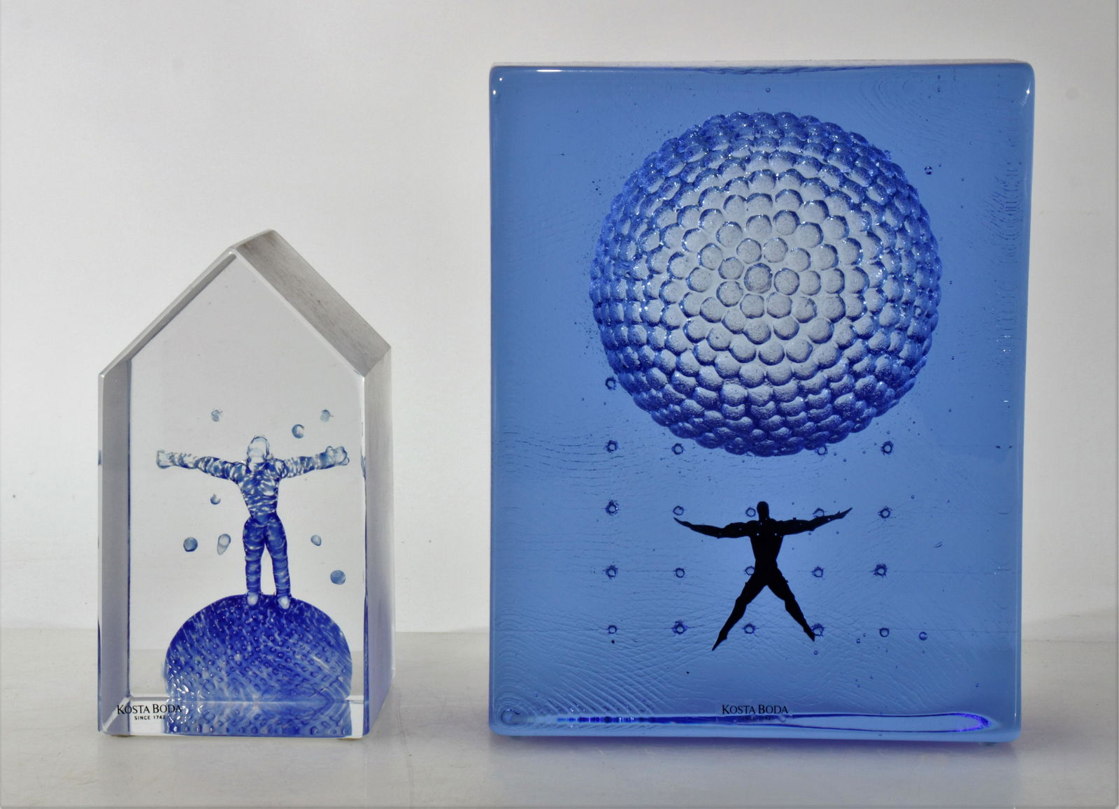 Bertil Vallien For Kosta Boda - Two Figures: Bertil Vallien (b. 1938) for Kosta Boda - Two table sculptures. "Starlight Dancer" and a second. Both signed. Dimensions: 7.5" H x 6" W and 5.5" H x 3 1/16" W Property from the Estate of John 'Parker'