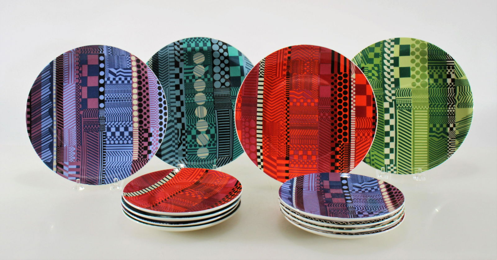 Eduardo Paolozzi for Royal Doulton Plates: Eduardo Paolozzi works printed on porcelain plates, manufactured by Royal Doulton. Including eight salad plates and four dinner plates. Dimensions: 6.5" diam and 8.75" diam Property from the Estate of