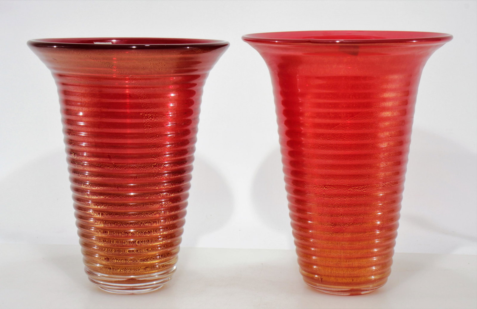 Two Archimede Seguso Murano Glass Vases: Two Archimede Seguso Murano Glass Vases. Black and clay red with gold flecks. Dimensions: 13" H x 10" diam, 13" H x 10.75" diam Property from the Estate of John 'Parker' Prindle, Jr., Boston, MA.