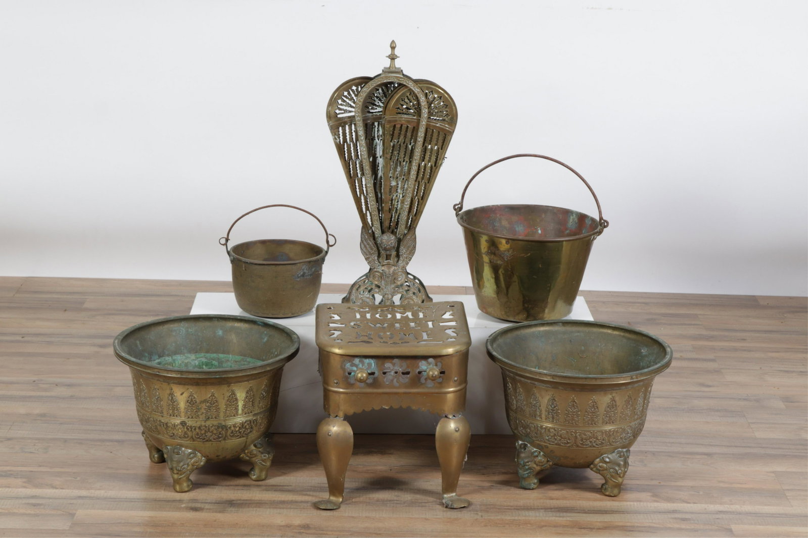 Eurasian Group of Metal Fireplace Metal Fireplace: Eurasian/American Group Metal Fireplace Accessories and planters, includes southeast Asian elephant footed Planters, a Home Sweet Home brass footman, a Victorian pierced brass fan fire screen and two 