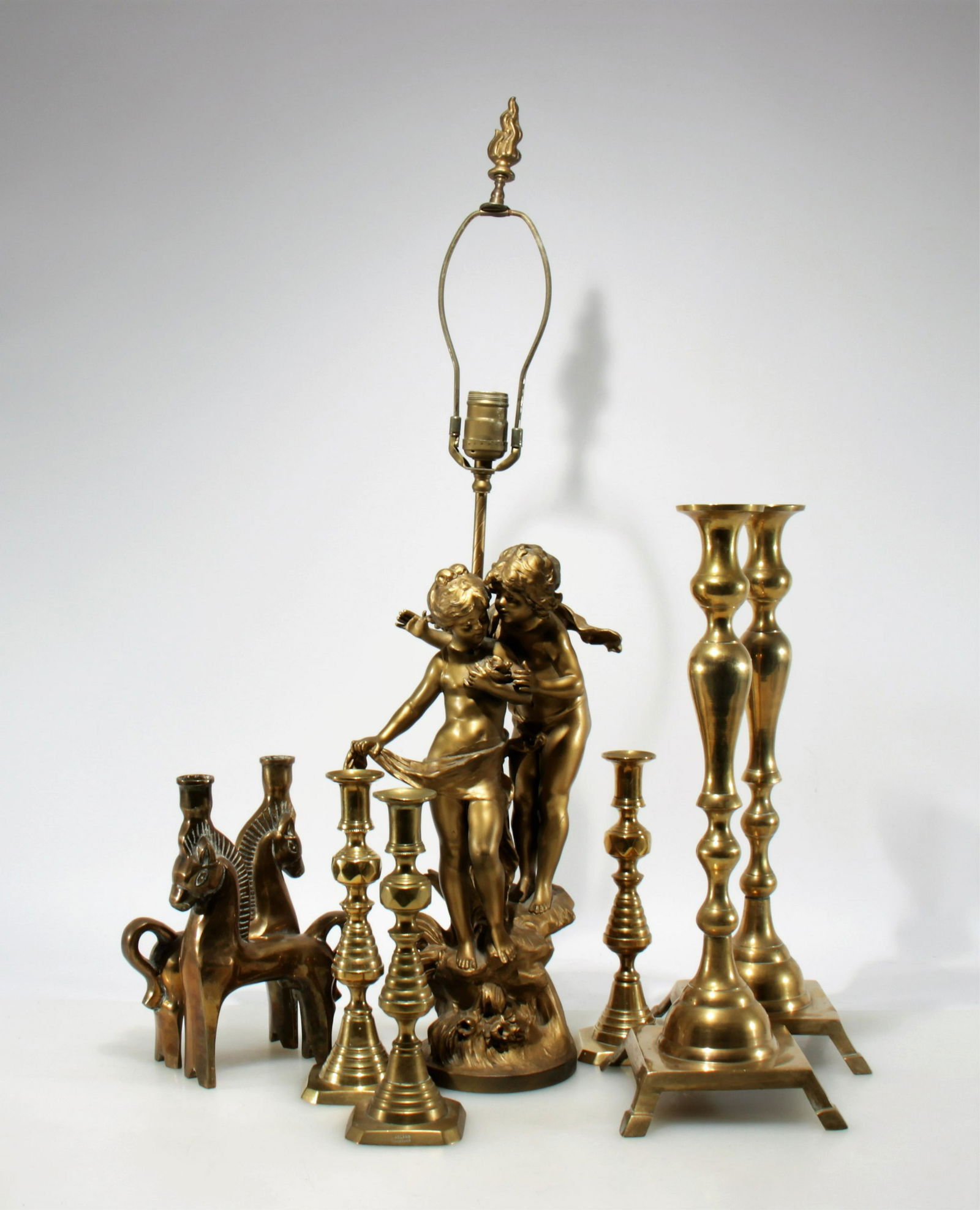 7 Brass Candlesticks and Figural Metal Lamp (1 of 6)