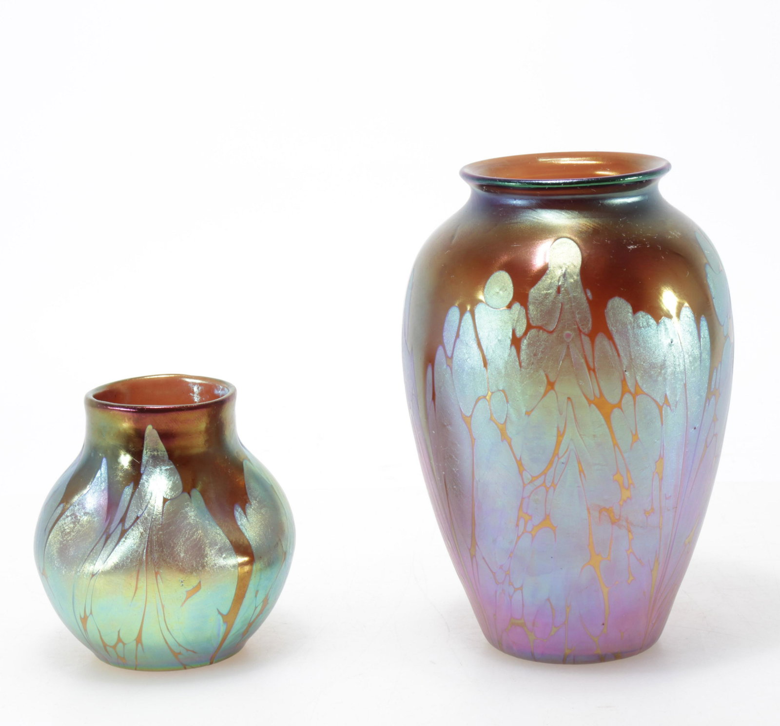 Two Loetz Style Iridescent Glass Vases: 2 Loetz Style Iridescent Glass Vases, unsigned Dimensions: Larger 7" H Property from the Estate of John 'Parker' Prindle, JR., Boston, MA.