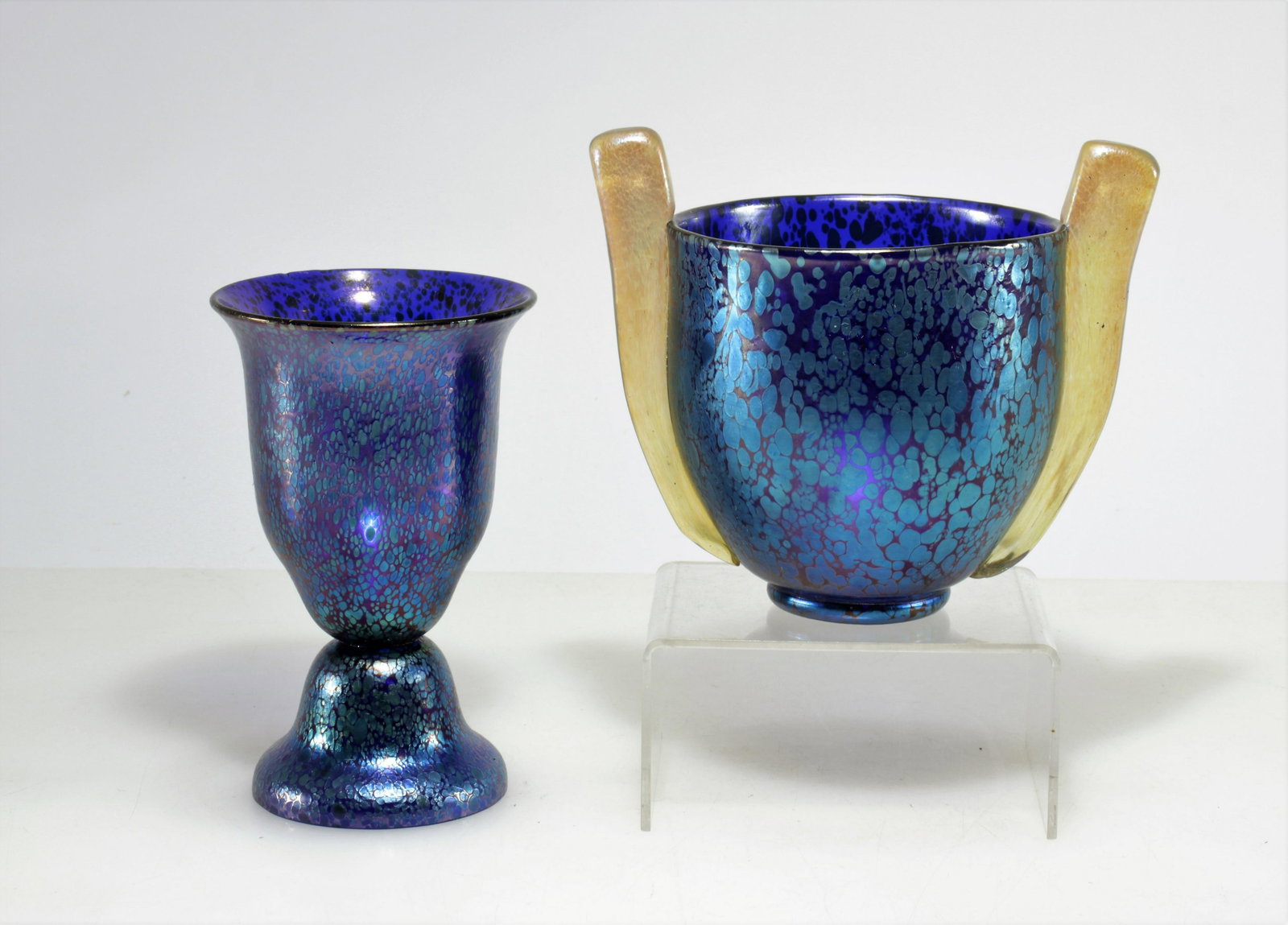 Loetz - Blue Iridescent Glass Cup & Bowl: 2 Loetz Blue Iridescent Glass Cup & Bowl, unmarked Dimensions: Larger 6.5" H Property from the Estate of John 'Parker' Prindle, JR., Boston, MA.