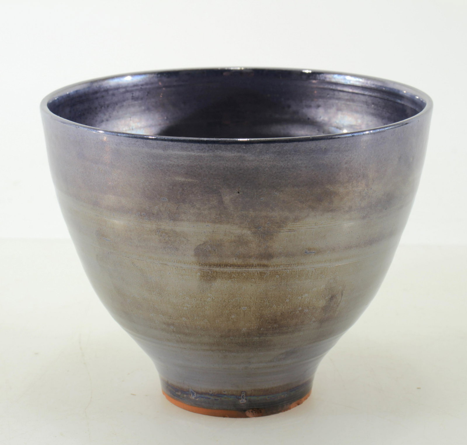 Beatrice Wood - Lustre Glaze Bowl: BEATRICE WOOD (American, 1893 - 1998). Perrywinkle lustre glaze footed bowl. Signed BEATO on bottom. Dimensions: 4.5" H x 5.75" diam. Property from the Estate of John 'Parker' Prindle, JR., Boston, MA