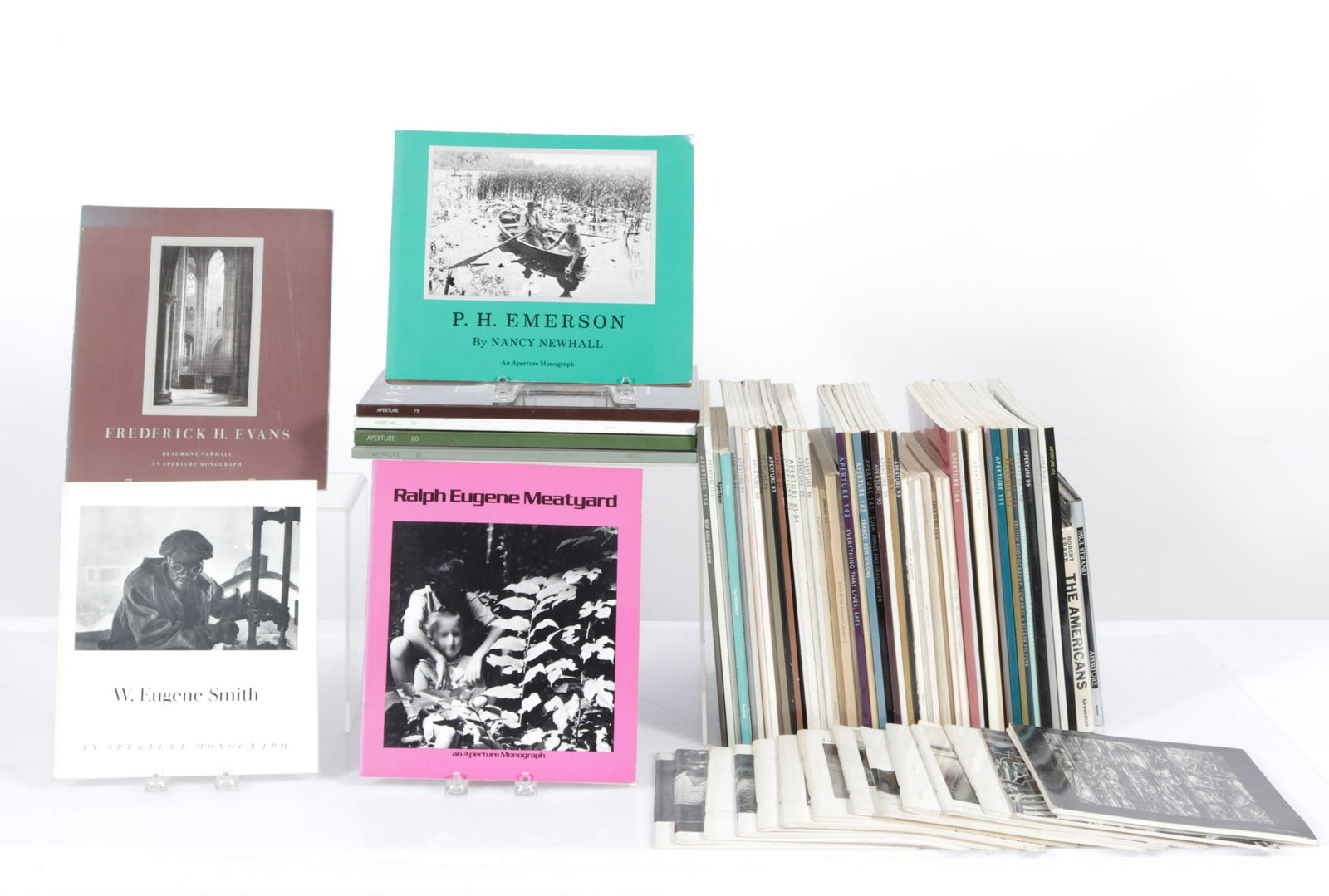 Aperture Photography Publications: 1960's-1990's. Collection of hard and soft covers. Six hardcovers includes Paul Strand and The Americans: Photographs by Robert Frank With Introduction By Jack Kerouac, 1969. Dimensions: Strand 8.25"