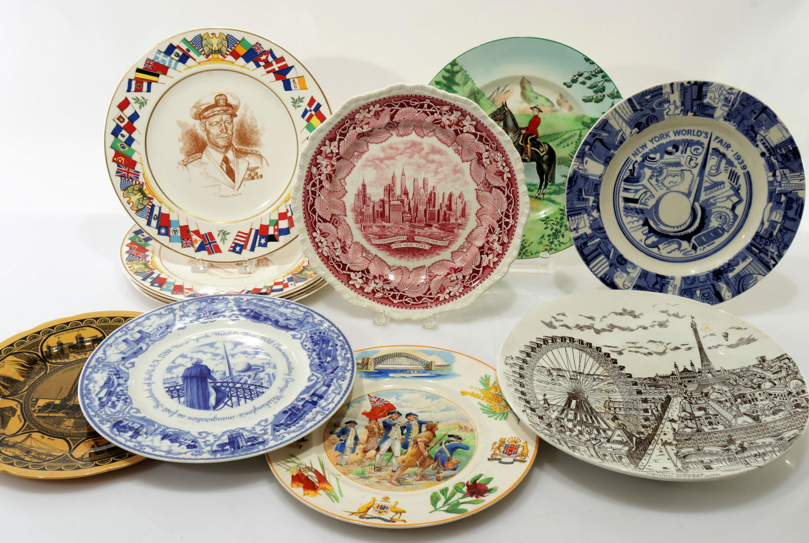 11 Commemorative Plates; World's Fair, Clarice: 11 Commemorative Plates, 39 World's Fair, Clarice Cliff, Allied Nations Dimensions: Largest 12.5" Dia. Property from the collection of Seymour Stein.