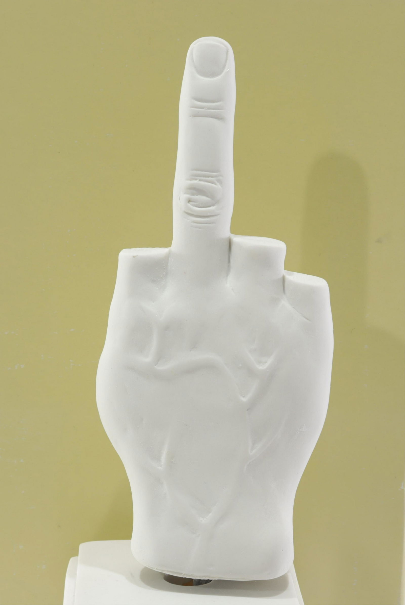 L.O.V.E. Model Musical Table Sculpture: By Maurizio Cattelan for Seletti (Italy). Scale reproduction of L.O.V.E. Cast resin, music box insert. Music box plays "Raindrops Keep Falling On My Head". Labeled on bottom. With box.Dimensions: 10.5