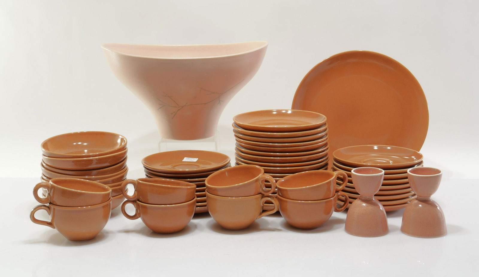 Russel Wright Iroquois Tableware: Iroquois Casual China by Russel Wright. 54 mixed count items: (8)cups, (18) saucers, (16) sides, (8) bowls, plate, (2) egg cups. In cinnamon/earth color. Including Russel Wright by Knowles "Sunflower"