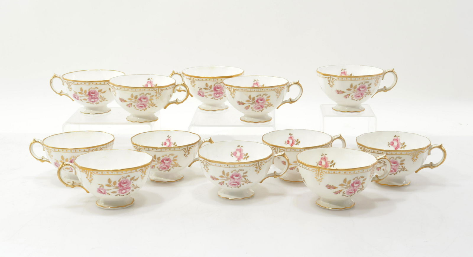 Group of Royal Crown Derby Tea Cups: Group of Royal Crown Derby Tea Cups, Royal Pinxton Rose pattern.Dimensions: 2.25" H x 4.5" diam including handle