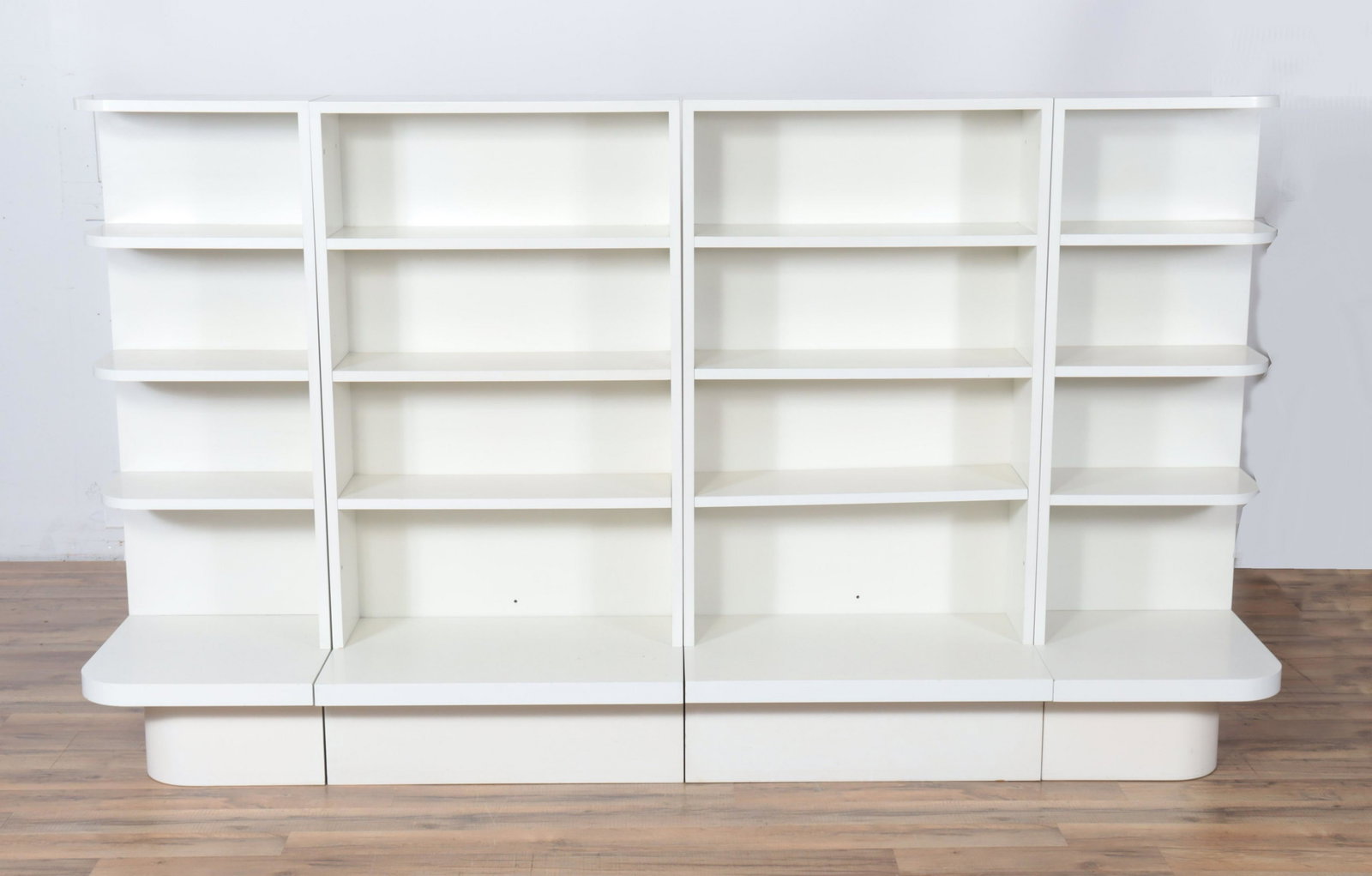 Winkle Fischer - German White Lacquered Bookcase: 4-Part German White Lacquered Bookcase, labeled Winkle Fischer, Dubel, Mauerwerk Dimensions: 47.75" H x 83.5" W x 16" D From a Kent Connecticut Collector