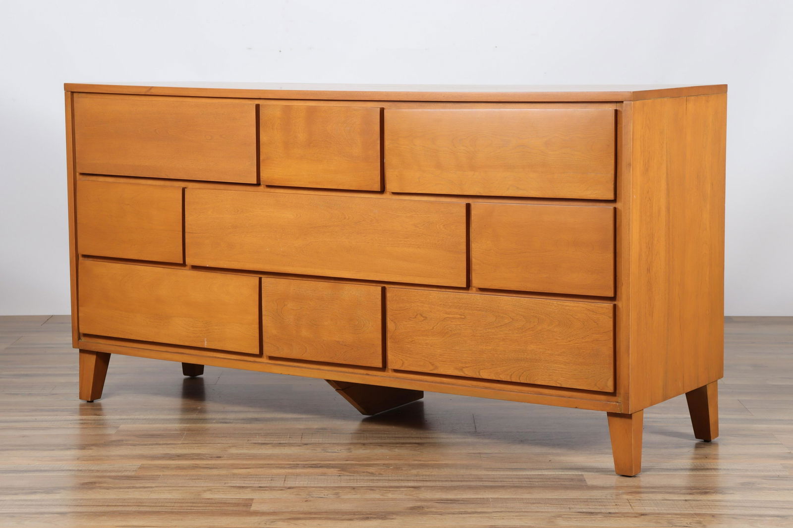 Russel Wright Maple Nine Drawer Dresser: Russel Wright "Modernmates" For Conant Ball Furnituremakers (Mass., U.S.). Drawers with finger pulls recessed under bottom each drawer front.Dimensions: 58"L x 18.25 x 30H