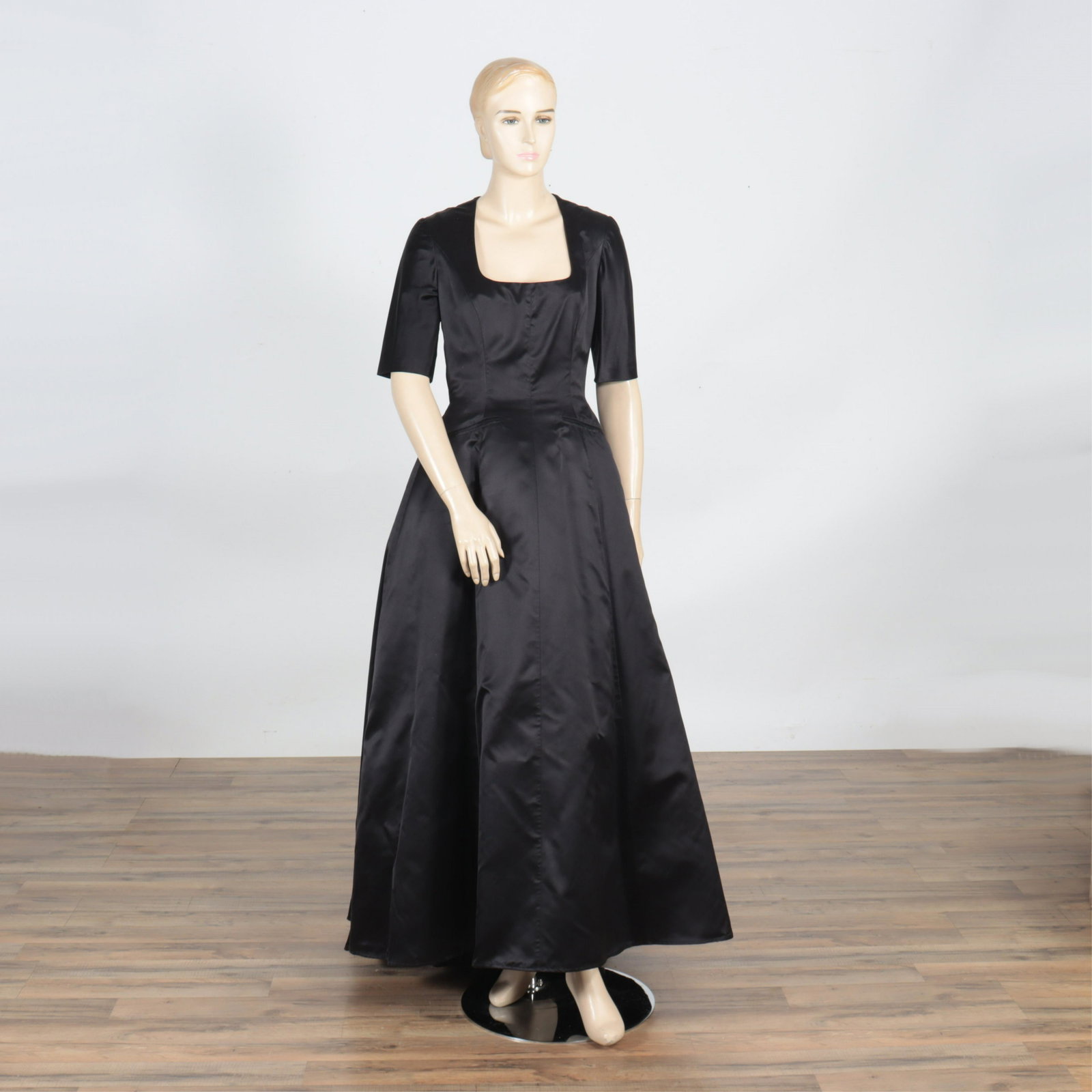 Hermes Black Silk Evening Gown: Hermes Black Silk Evening Gown, size 40. Form fitting pleats, deep square neckline, thick underskirt. Approximate Measurements:Shoulders: 15"Chest (underarm to underarm): 31"Waist: 28"Hips: 42"Length 