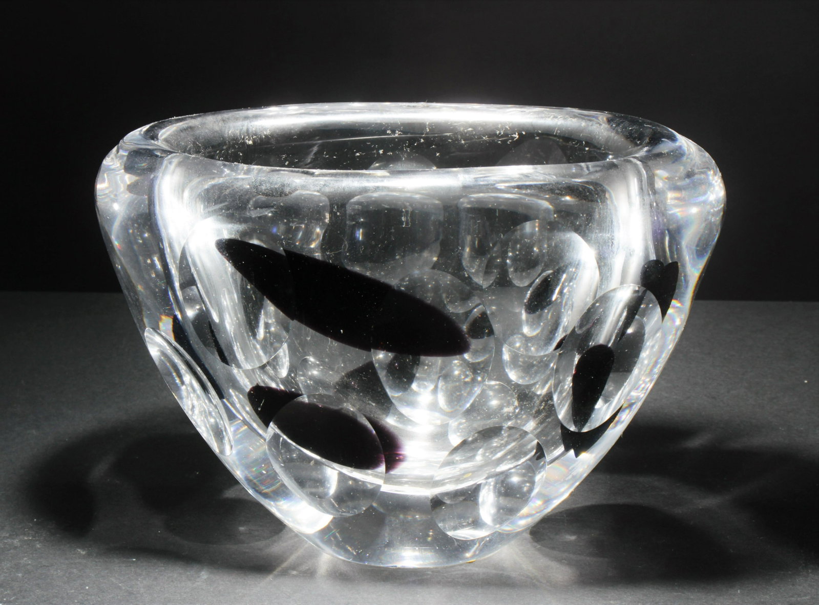Vicke Lindstrand for Kosta Boda - Vase: Vicke Lindstrand for Kosta Boda - Vase with deep purple accents and oval cuts. Signed on bottom Kosta LS 609. Dimensions: 5.5" H x 7.5" W x 3.5" D