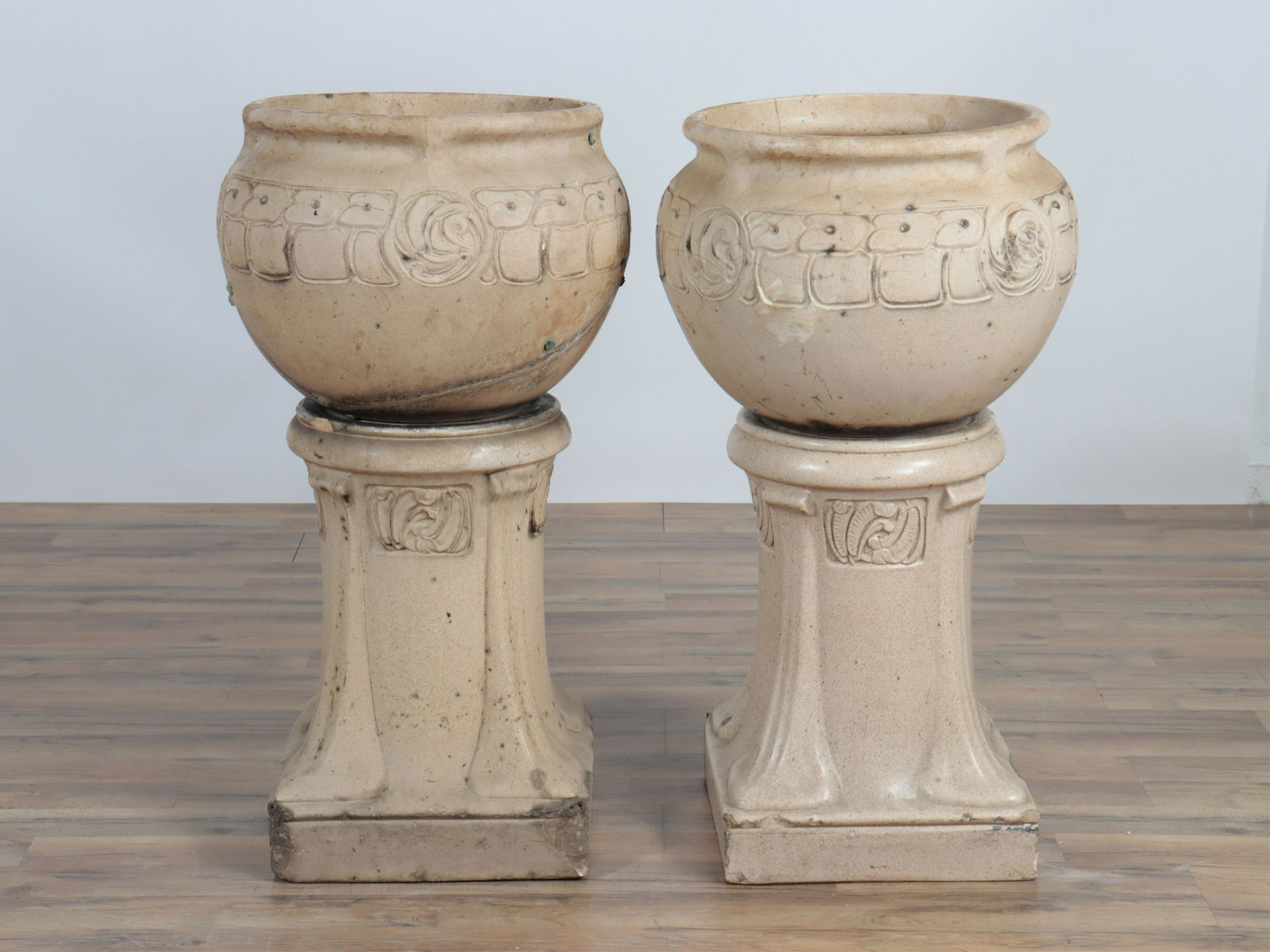 Archibald Knox - Lefcoware Fire Clay Jardinieres: Archibald Knox - Pair Lefcoware Fire Clay Jardinieres & Stands, impressed Dimensions: 37.5" H x 14" Dia. (including stand) Property from the personal collection of Seymour Stein.