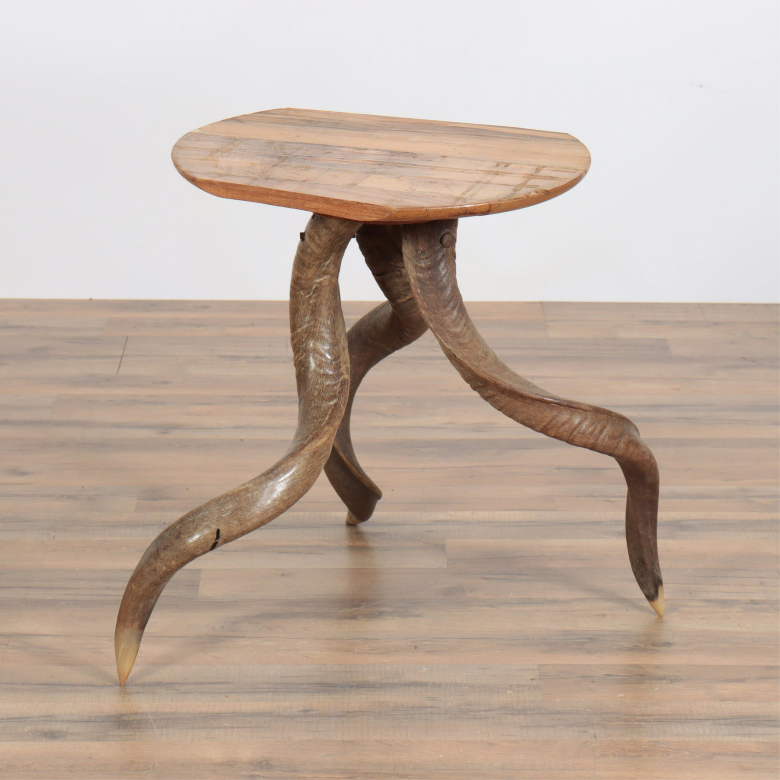 Rustic Horn Table: Rustic Horn Table. Top is primitive, shows previous glue residue. Dimensions: 23" H Property from the personal collection of Seymour Stein.