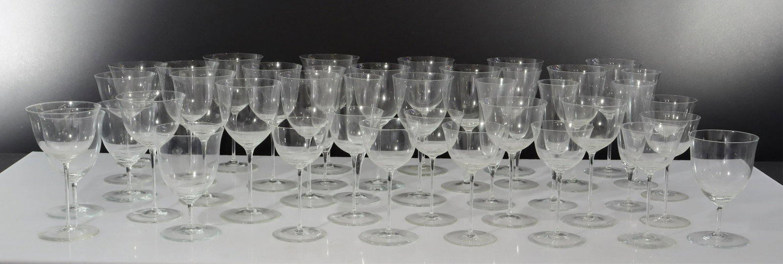 Lobmeyr 51 Pc. Stemware Collection: Partial service of wine, fluted, cordial, water.14- 7.25"H x 3.75 7- 7H (fluted) 6- 6.5H x 3.5 dia. 9- 5.75H 4- 5.25H x 3.5 dia. 11- 4H (cordial) Dimensions: