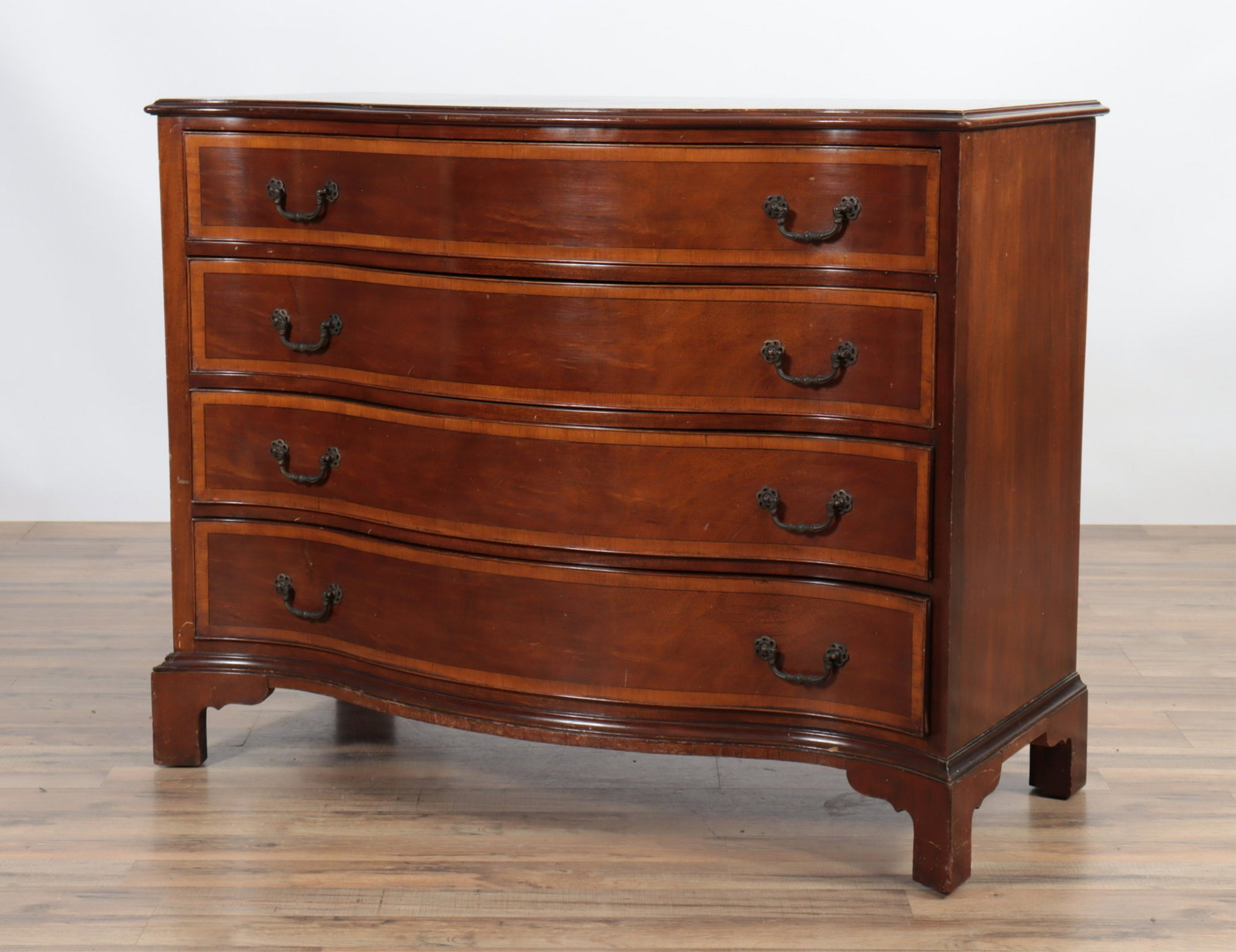 George III Mahogany Serpentine Chest: George III Mahogany Serpentine Chest of Drawers, labeled W&J Sloane Dimensions: 34" H x 44' W x 20" D Property from a Larchmont Estate.