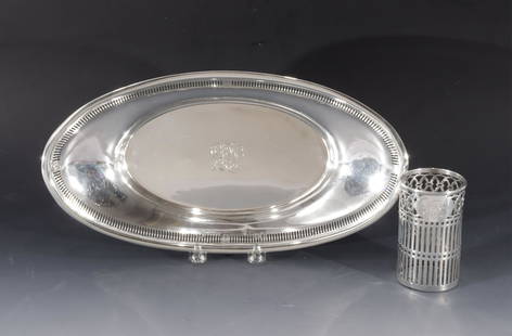 Sterling Silver Bread Basket & Glass Holder: American Sterling Silver oval Bread Basket with pierced rim. Stamped on bottom: Sterling T40B, right facing profile. Together with Watson & Newell Co Sterling Silver Glass Holder. 8.21 ozt.Basket 2"