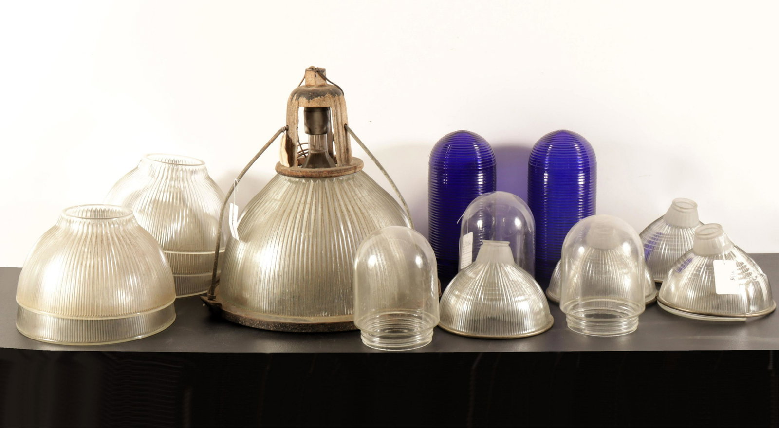 Industrial Lamp Shades: 14 Various Industrial Lamp Shades, one with fixture Largest 20" Dia. Property from the estate of Seymour Stein (1942 - 2023).
