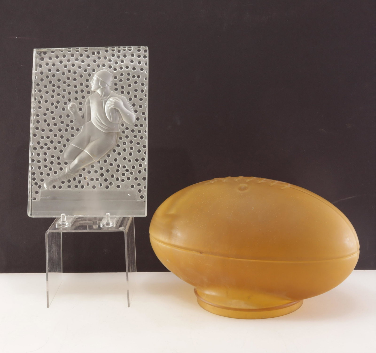 Sabino Glass Rugby Plaque & Football Shade: Sabino Glass Rugby Plaque & Football Shade Plaque 8.75" H x 6" W Property from the estate of Seymour Stein (1942 - 2023).