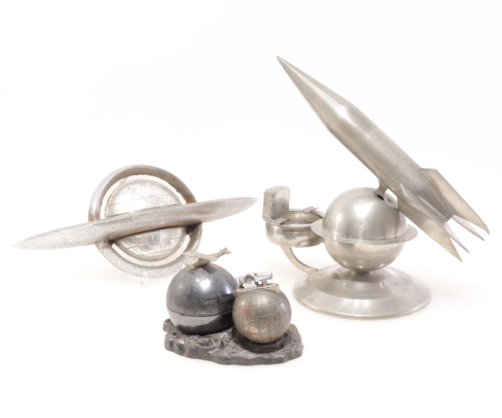 Space Aged - Globe Related Items: 4 Space Aged Metal Globe Related Items Largest 11.75" L Property from the estate of Seymour Stein (1942 - 2023).
