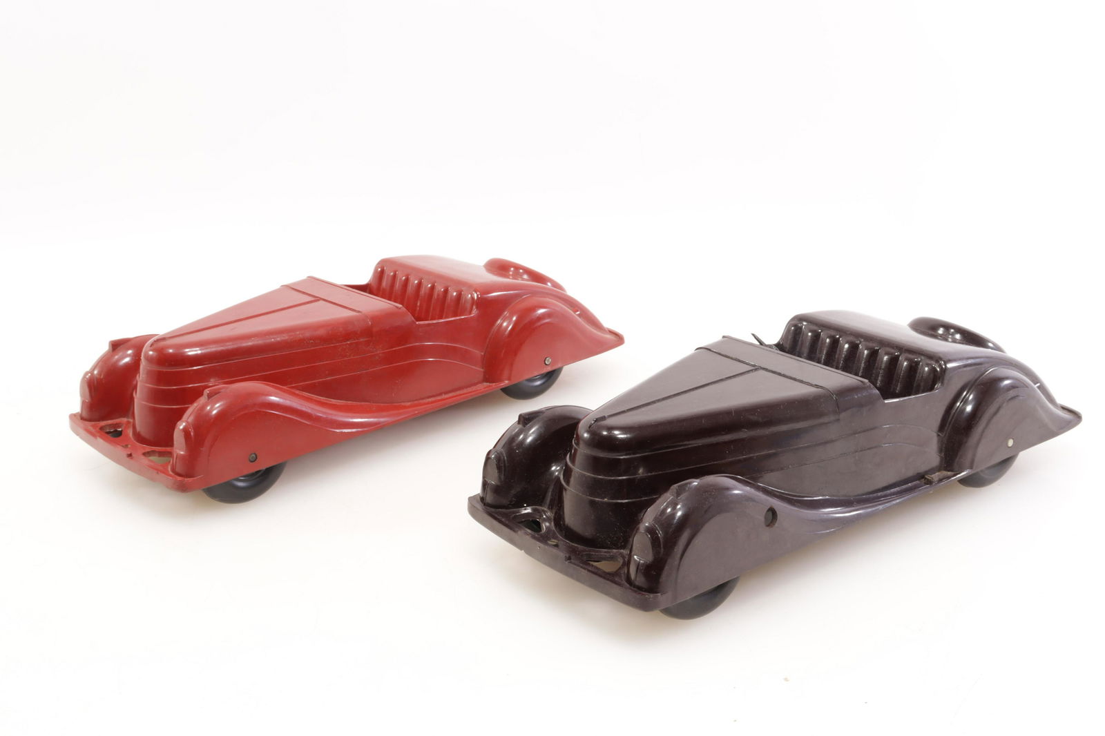 English Bakelite Cars: 2 English Bakelite Cars, GODEG13.5" LProperty from the estate of Seymour Stein (1942 - 2023).