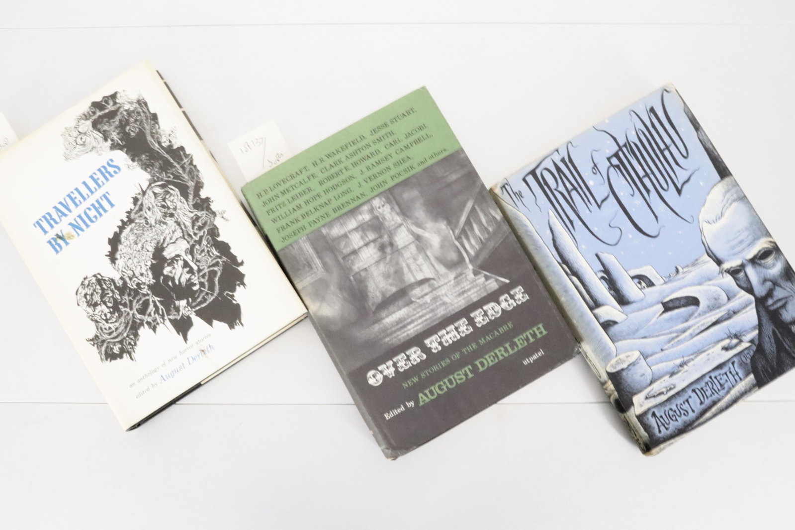 DERLETH. The Trail of Cthulhu.: ARKHAM House. - August DERLETH. The Trail of Cthulhu. Sauk City, WS: 1962. Octavo. Cloth, spine gilt, dust-jacket. (Backstrip of dust-jacket slightly toned). Provenance: King Lawrence Parker (bookplat