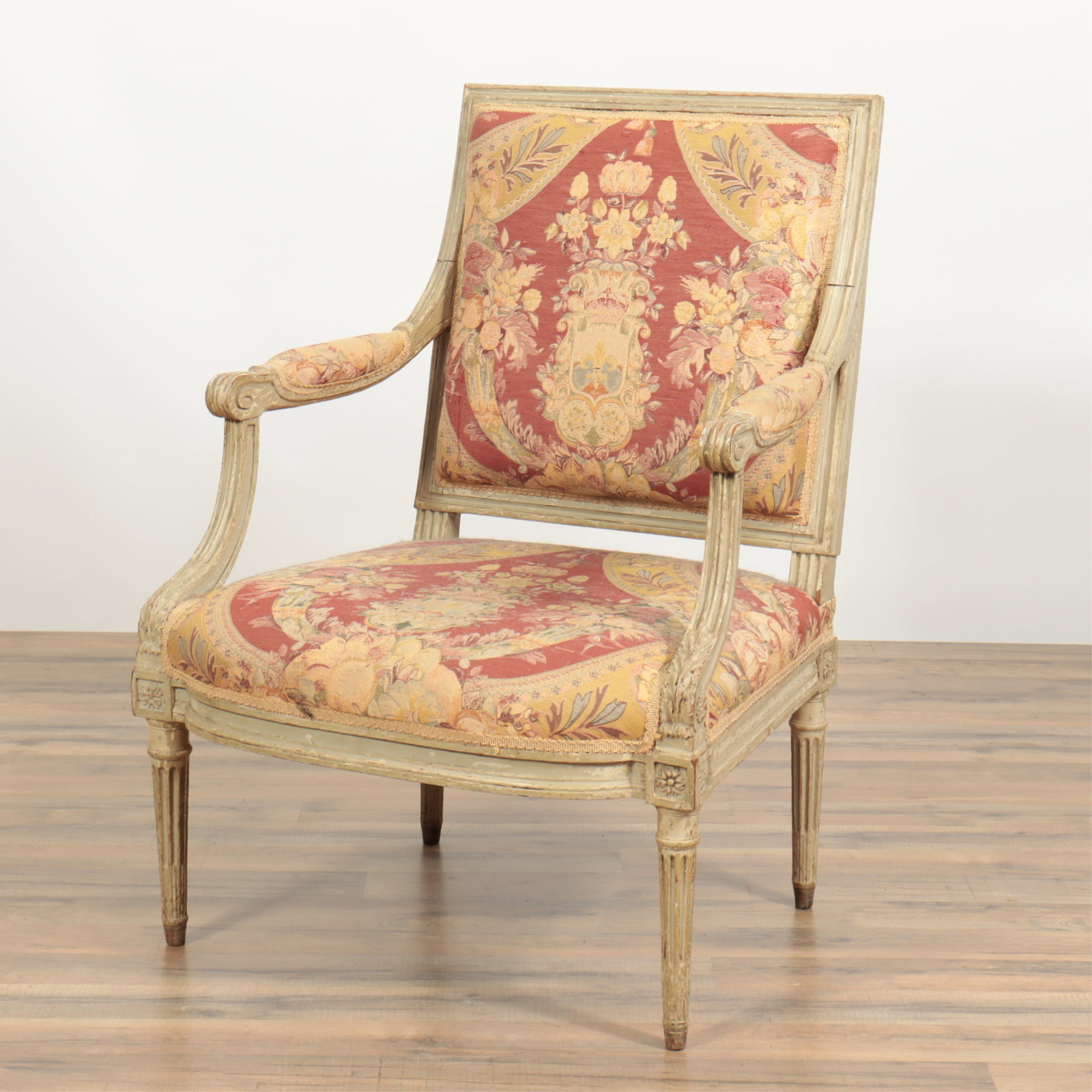 Louis XVI Grey Painted Fauteuil: Louis XVI Grey Painted Fauteuil, late 18th C. Upholstered foliate brocade. Partial maker's stand 36" H x 26.5" W x 26" D