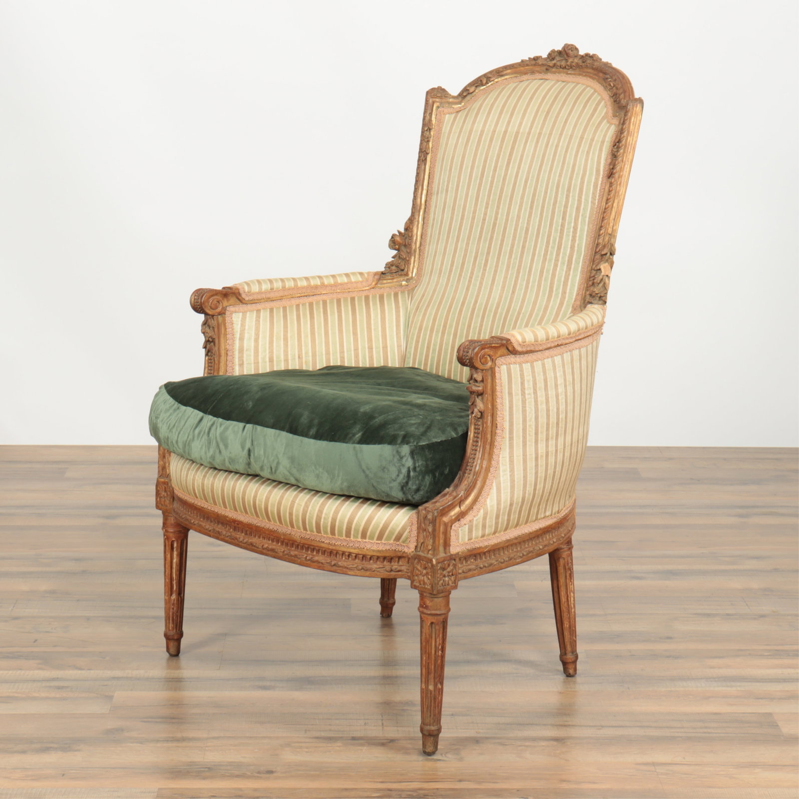 Louis XVI Style Giltwood Bergere: Louis XVI Style Giltwood Bergere, late 19th C. Upholstered in green striped silk 38.75" x 25.75" x 27.5" diam