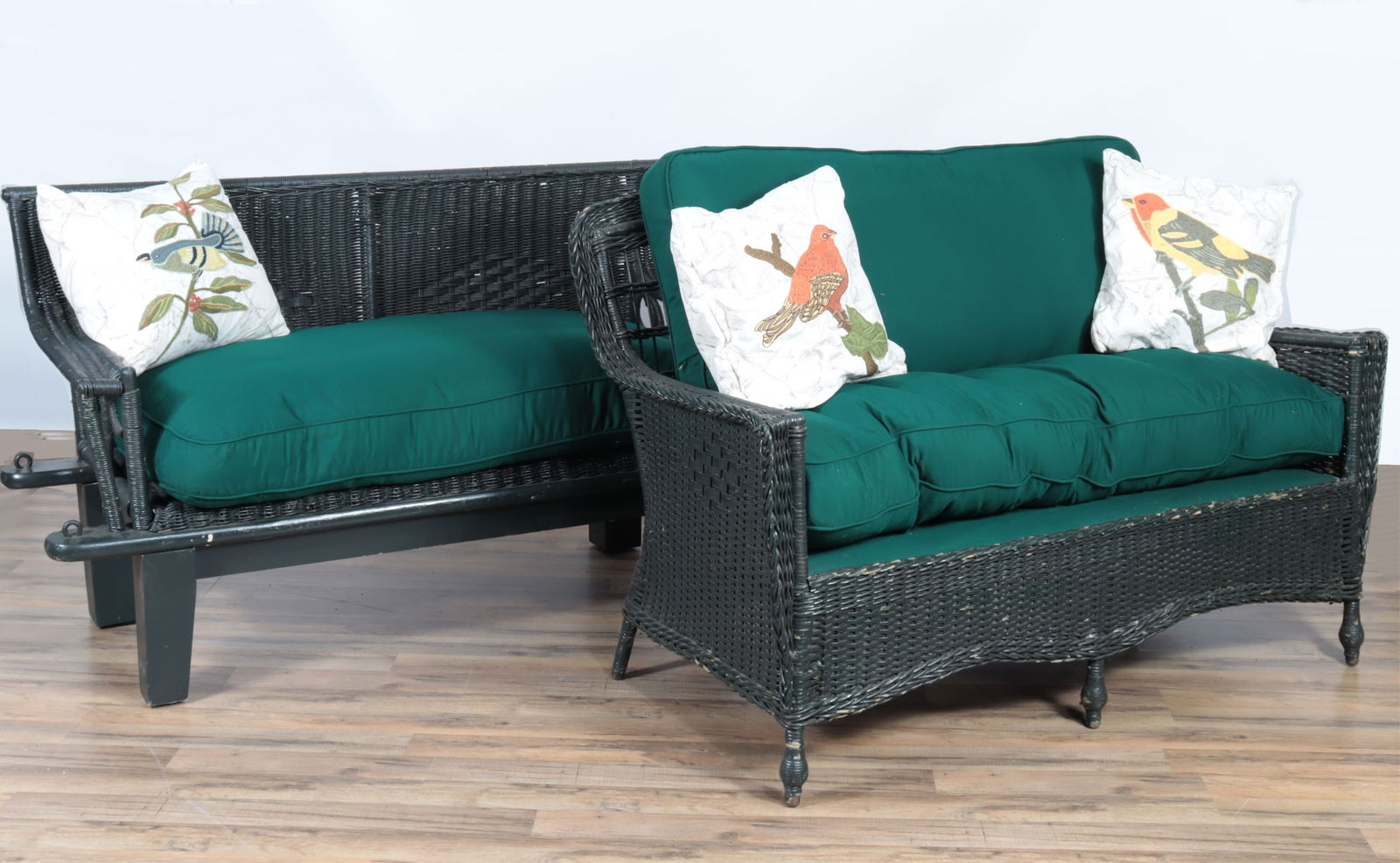 Two Green Painted Wicker Settees: Two Green Painted Wicker Settees, upholstered in green fabric.38" H x 54.75" W x 32" D