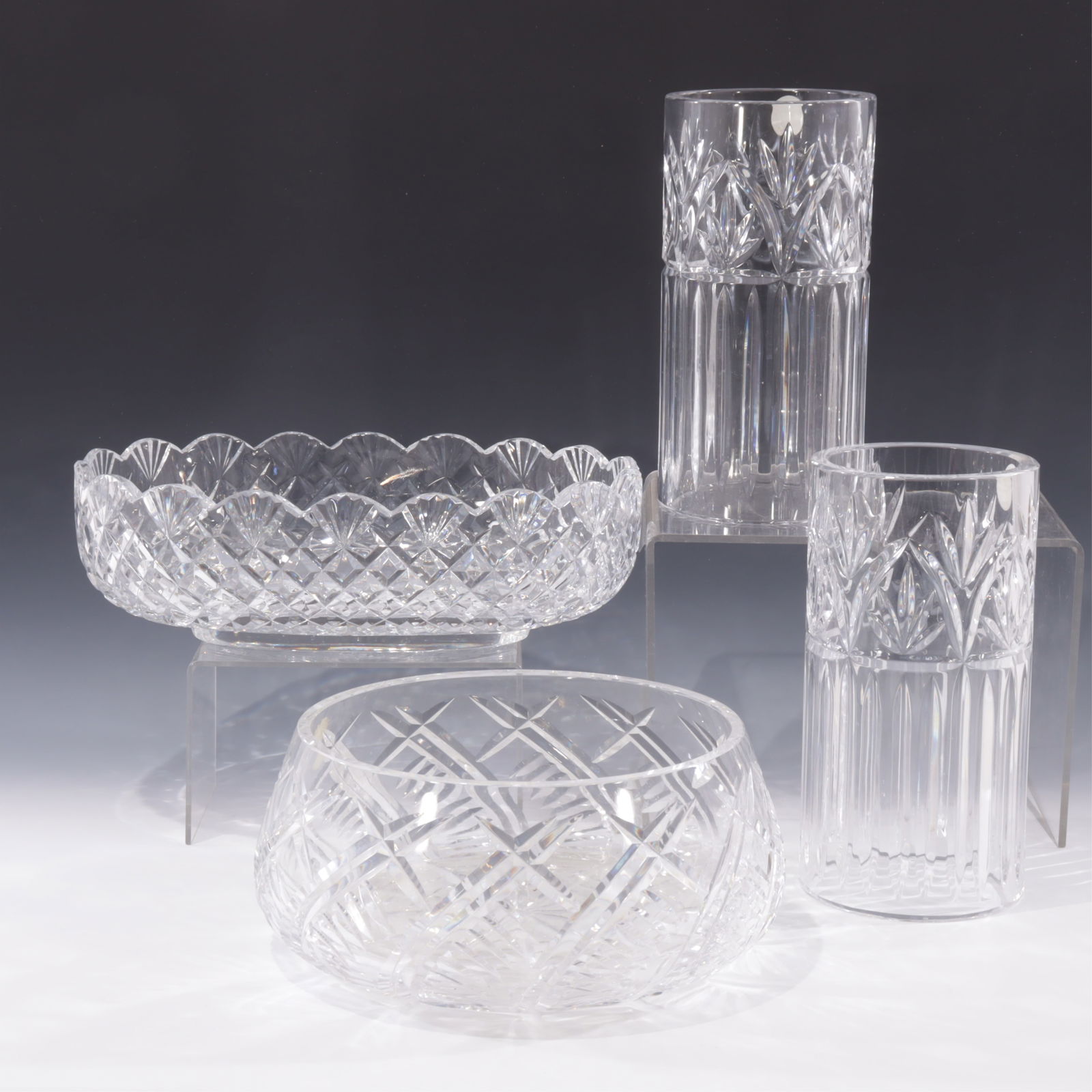Four Crystal Pieces, 2 Waterford Bowls: 2 cut crystal hurricanes, labeled made in Poland along with two bowls marked Waterford7 3/4, bowls 4 3/4 H and 3 1/2" HCollection from a Hamptons Long Island New York Home
