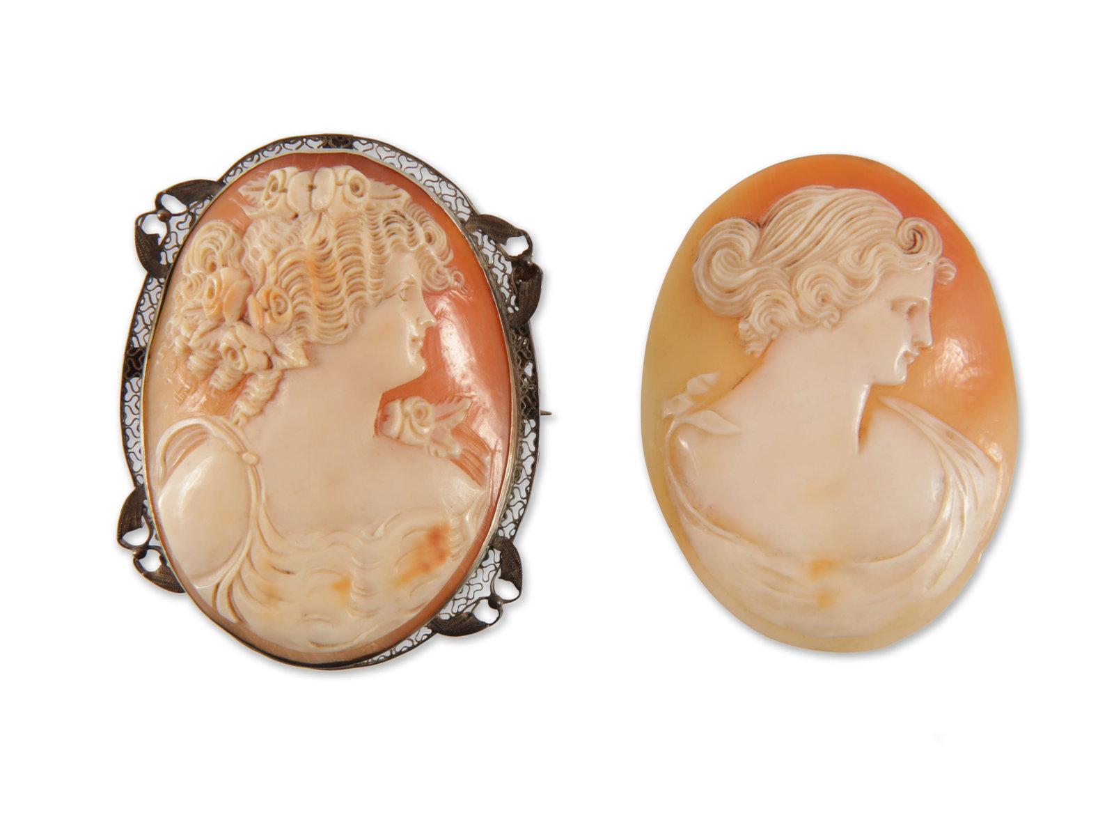 Two Cameos: Two Cameos. One set in 14k gold filigree frame, other unset. 2" x 1.5" Property from an Upper East Side Manhattan estate.