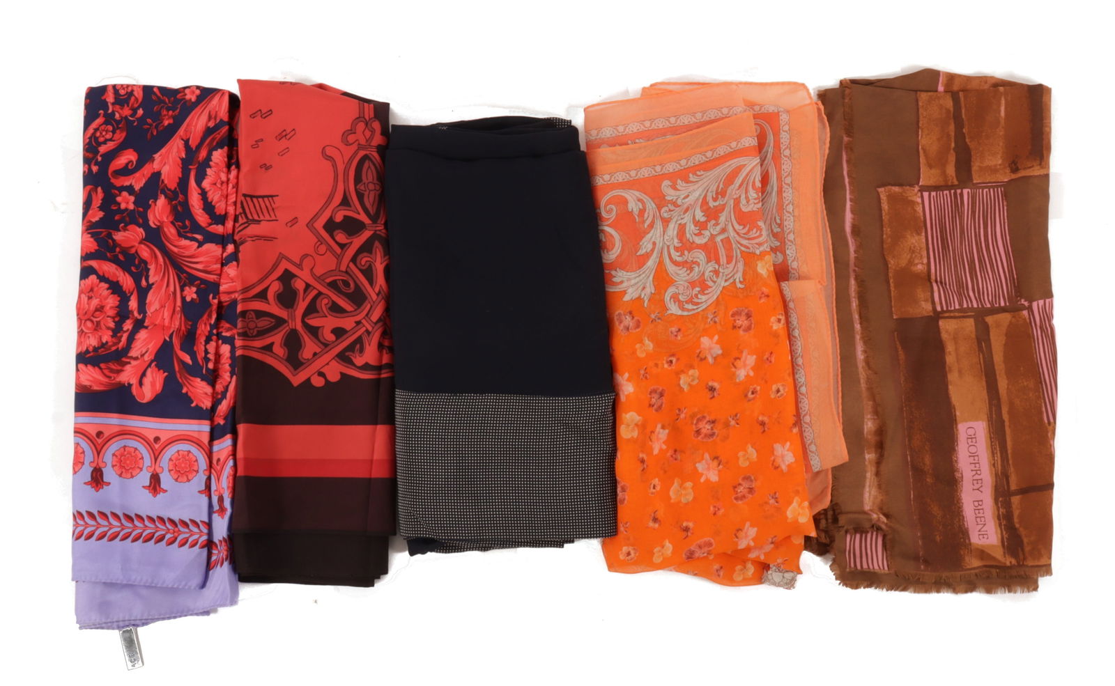 Group of Designer Scarves: Group of Designer Scarves. Versace purple and red twill silk. DKNY red and brown silk. Armani navy & polka dot silk. Geoffrey Been pink and brown twill silk. Versace orange silk.Property from the esta