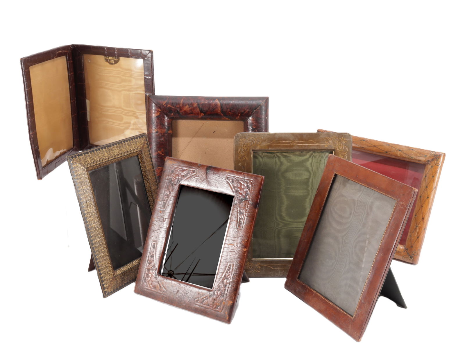 Radio Frame & Embossed Leather Frames: Radio Frame & 6 Embossed Leather Picture Frames, including one radio frame Radio Frame 12" H Property from the estate of Seymour Stein.