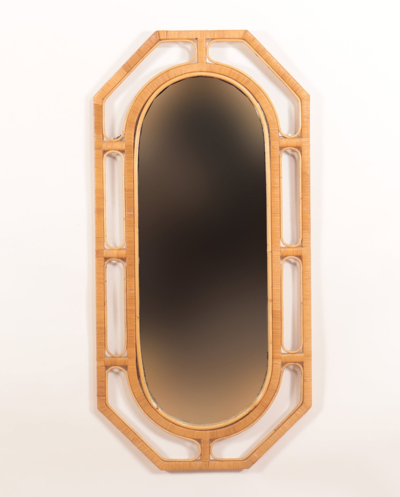 Rattan and Woven Grass Mirror: Rattan and Woven Grass Mirror51.5" H x 25" WProperty from the estate of soap-opera actress Elizabeth Hubbard (1933 - 2023), known for her roles on The Doctors and As the World Turns.