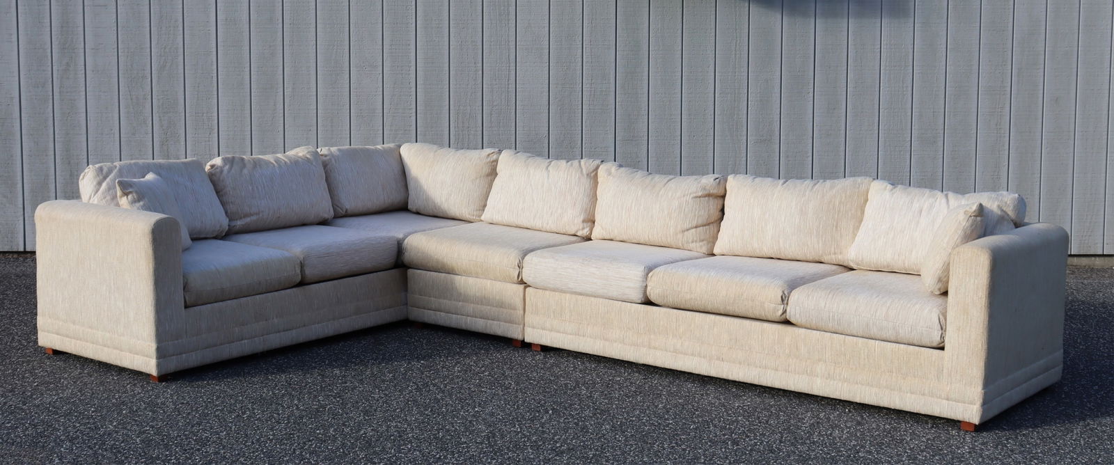 Selig Sectional Sofa: 3-Piece Selig Sectional Sofa, upholstered in woven beige cotton. Includes 8 extra green cushions26.25" H x 89" x 149"