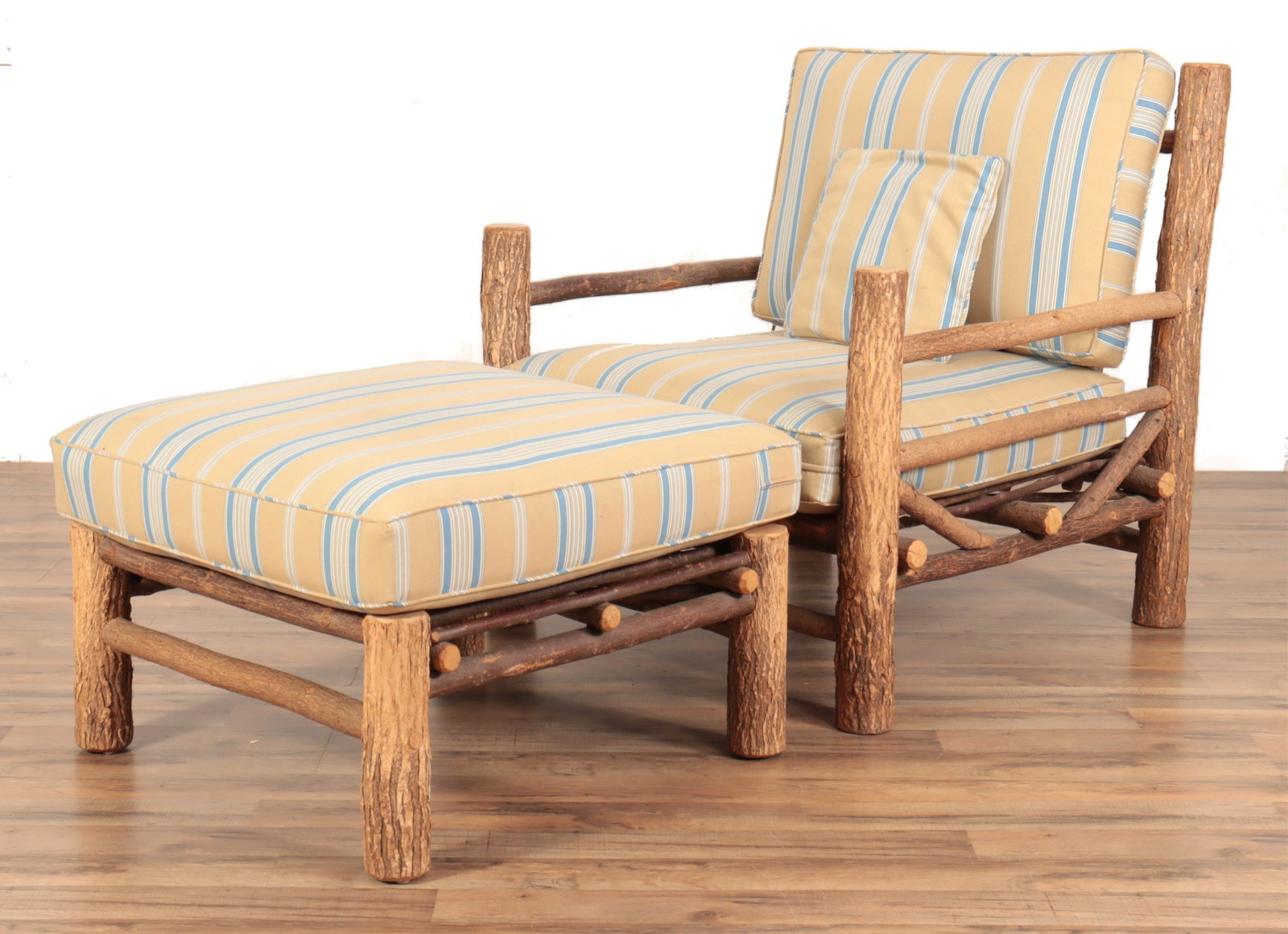 Adirondack Style Live Edge Armchair & Ottoman: Adirondack Style Live Edge Armchair & Ottoman, upholstered in gold & blue striped fabric 36.5" H x 34.5" W x 34.5" D, Ottoman 13" H x 28" Square Property from the estate of soap-opera actress Elizabet