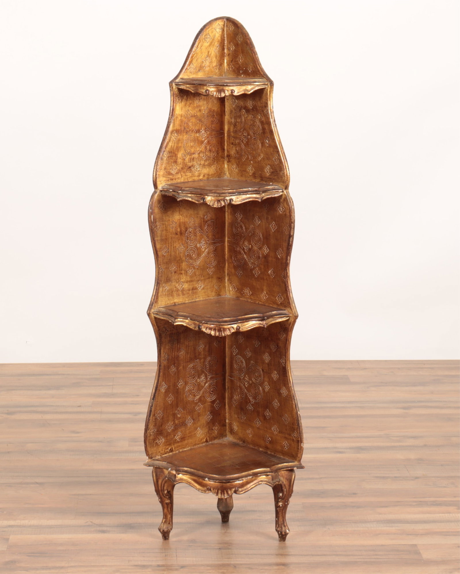 Venetian Rococo Style Giltwood Corner Bookshelf: Venetian Rococo Style Giltwood Corner Bookshelf, stamped CP Leathercrafts 50.75" H x 15.75" W x 12" D