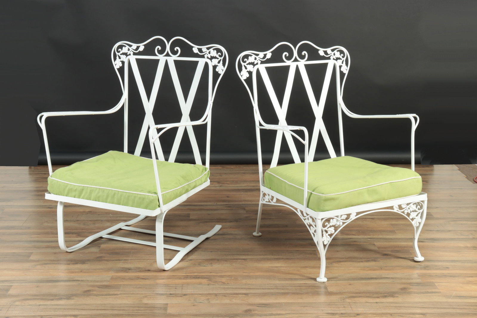 Two Woodard 'Acorn' Patio Chairs: Two Woodard Acorn Patio Chairs. One classic Spring Chair form plus an arm chair. Seat cushions upholstered in lime green cotton. No back cushions available. Spring Chair: 38" H BY 26.5" W BY 23" D.Arm