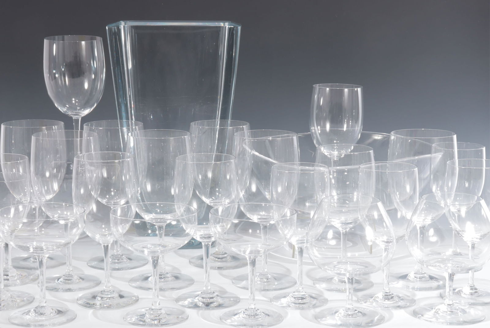 Baccarat Stemware, Steuben Bowl, Strombergshyttan: 23 Pieces of Baccarat Stemware, Steuben Bowl along with a Swedish Strombergshyttan Vase # B1046, all marked Baccarat eight wine 7 3/4"H five 6 5/8"H, four 6 1/4"H, 3 champagne 4 3/4"H, three brandy 5