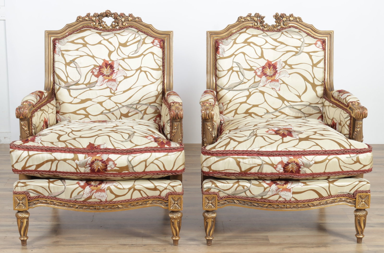 Pair of Vincente Wolf Louis XVI Style Bergeres: Pair of Vincente Wolf Louis XVI Style Giltwood Bergeres, upholstered in embroidered beige silk 32"W x 28"D x 40"H Property from a Connecticut collection.
