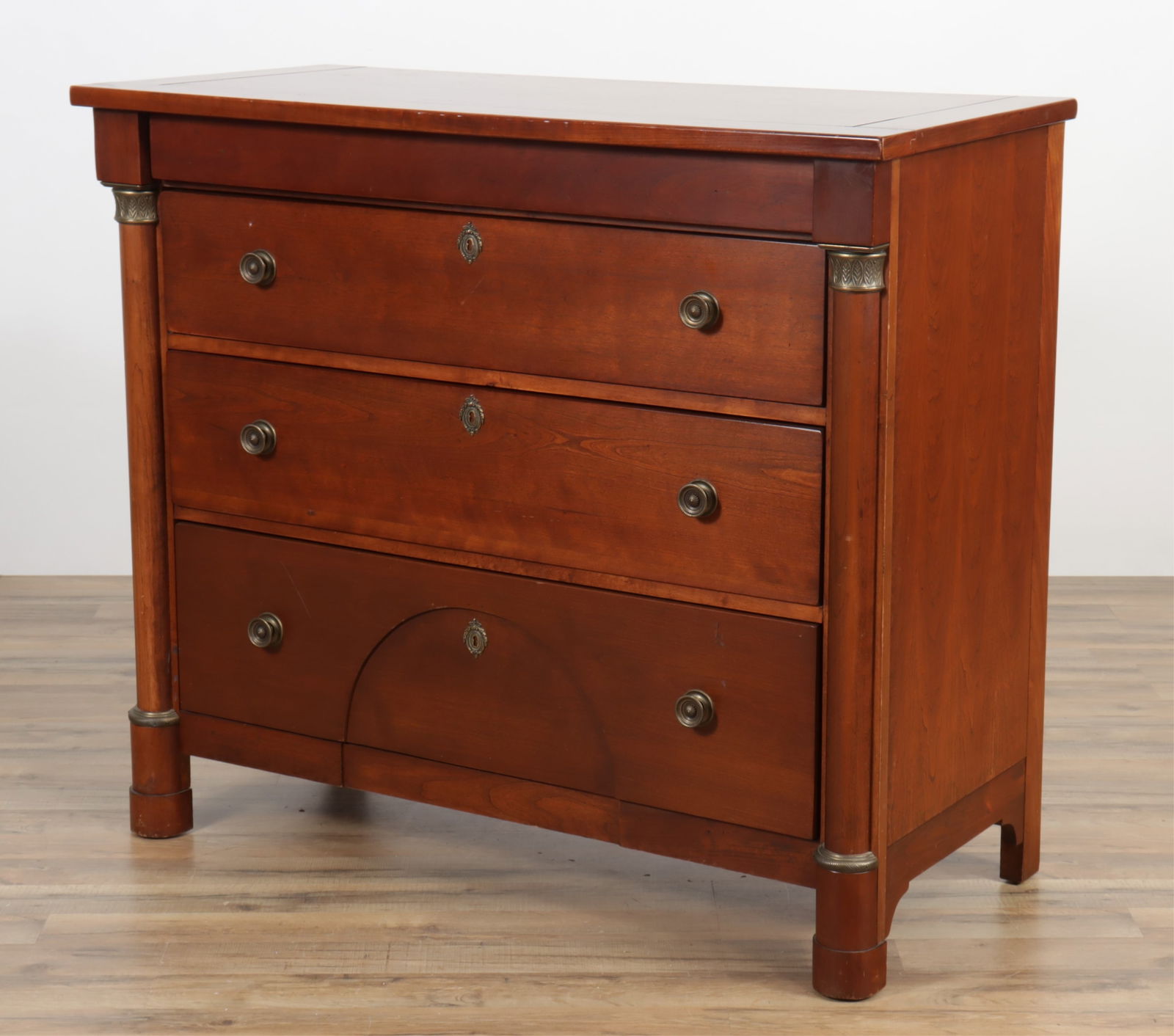Lexington Empire Style Brass Mounted Commode: Empire Style Brass Mounted Cherry Commode, by Lexington Furniture38" H x 44" W x 20" DProperty from a Connecticut collection.