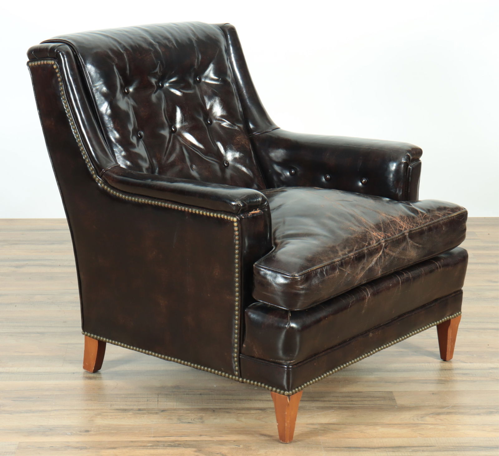 Vintage Henredon Leather Club Chair: Vintage Henredon Leather Club Chair, circa 1960. Upholstered with brown leather with brass tack detail.34" H x 31" W x 37" D.From a Manhattan Home